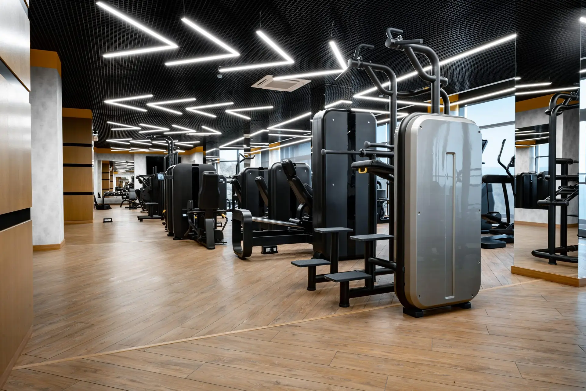 Modern gym interior featuring advanced fitness equipment and sleek design, emphasizing optimized operations and member engagement for leisure centres.