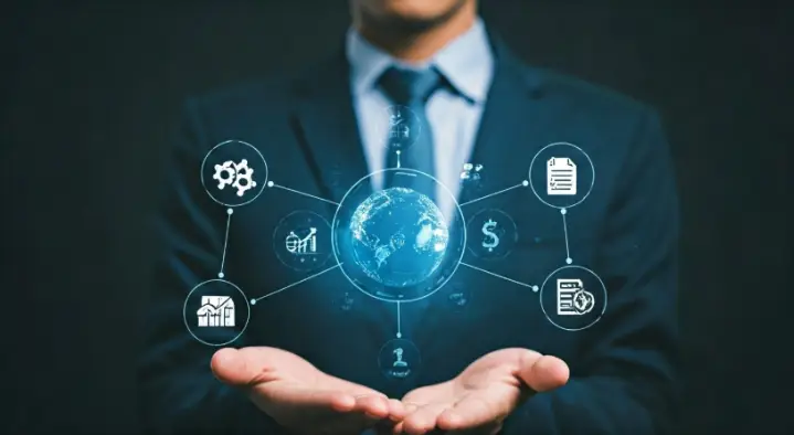 Business professional holding glowing globe with icons representing data management, CRM, and automation solutions for enhancing operational efficiency.