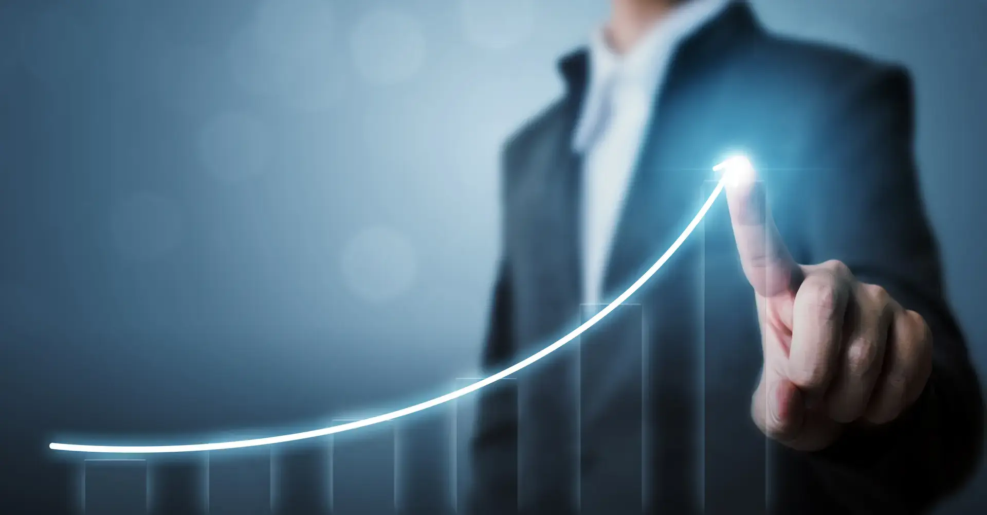 Business professional touching a glowing upward trend graph, symbolizing growth and digital marketing strategies for small businesses.